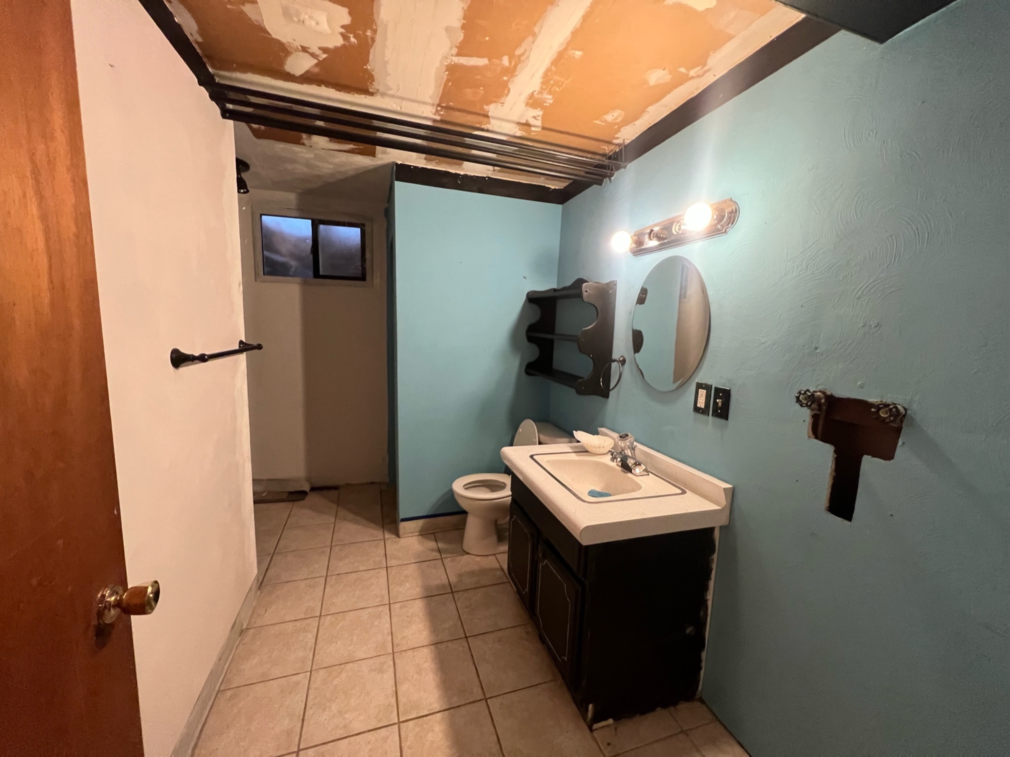Dated and unfinished bathroom before renovation